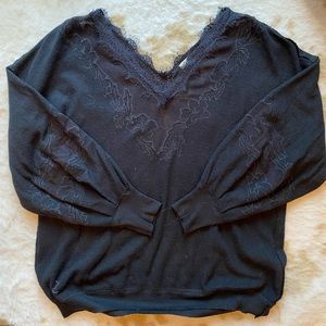 Free People black sweater with lace detailing in collar, back & sleeves. Size L